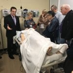 COMsimulation_IMG_5927-768x1024 A group of LIFE members standing around a medical dummy.